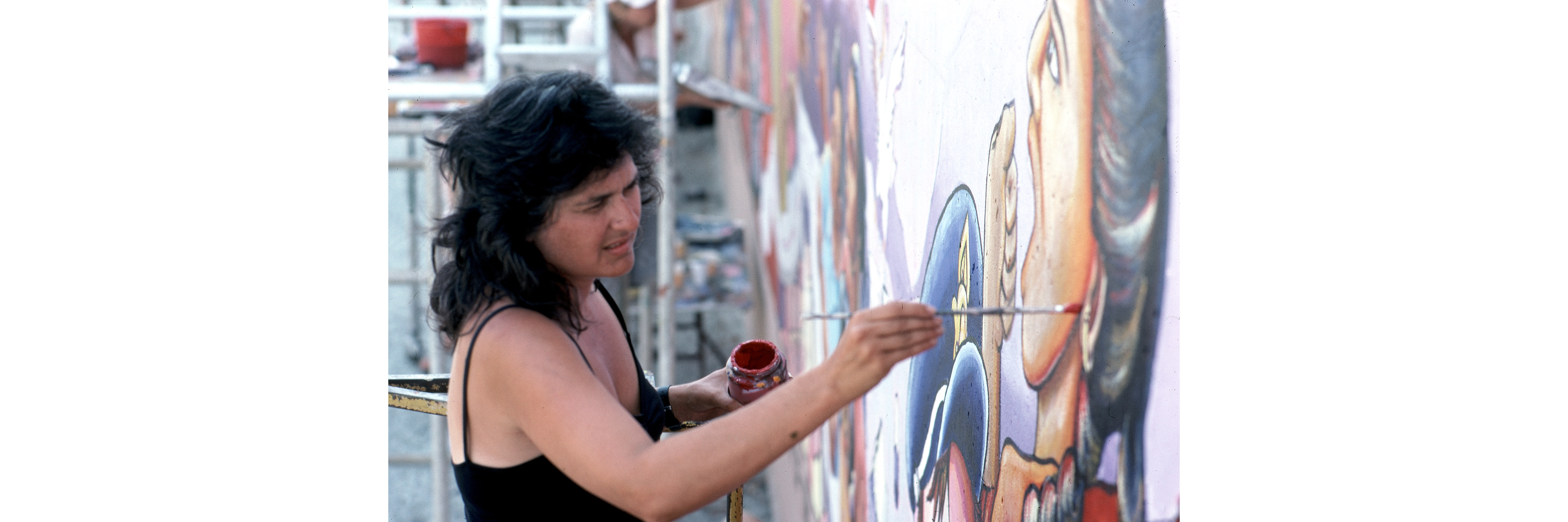 Judy Baca painting The Great Wall of Los Angeles, summer of 1983, photo courtesy of the SPARC Archives (SPARCinLA.org)