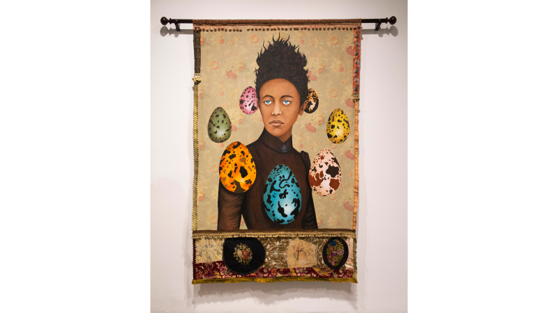 Lezley Saar, Septime, a collector of breezes, hoarder of voices, and gatherer of olfactory ephemera, once hanged her lover into a lake to protect him., 2019. Acrylic on fabric, embellishments, curtain rod, 89 x 76 inches. Collection of Diane Allen. 