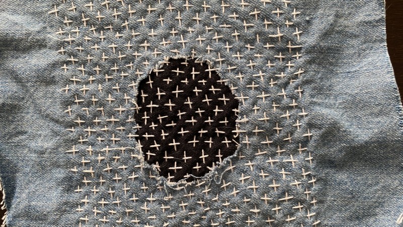 example of sashiko stitching on two different color fabrics
