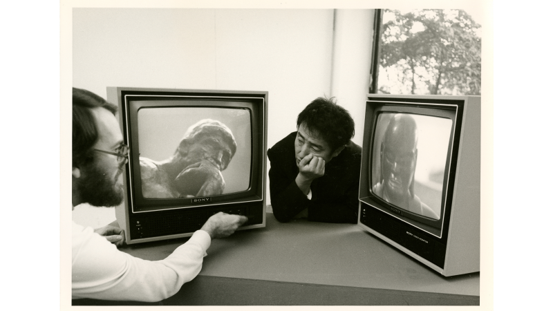 photograph of the direct Nam June Paik with a TV